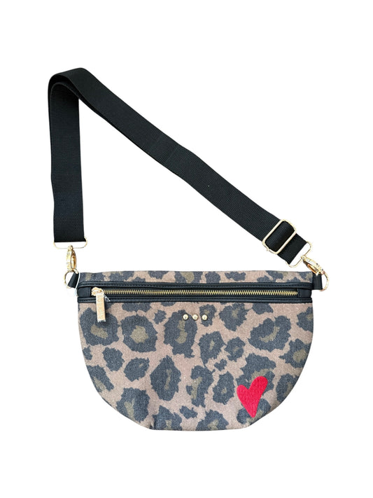 A leopard print fanny pack with a black adjustable strap, gold-tone hardware, and a small red heart on the front, shown against a plain white background.