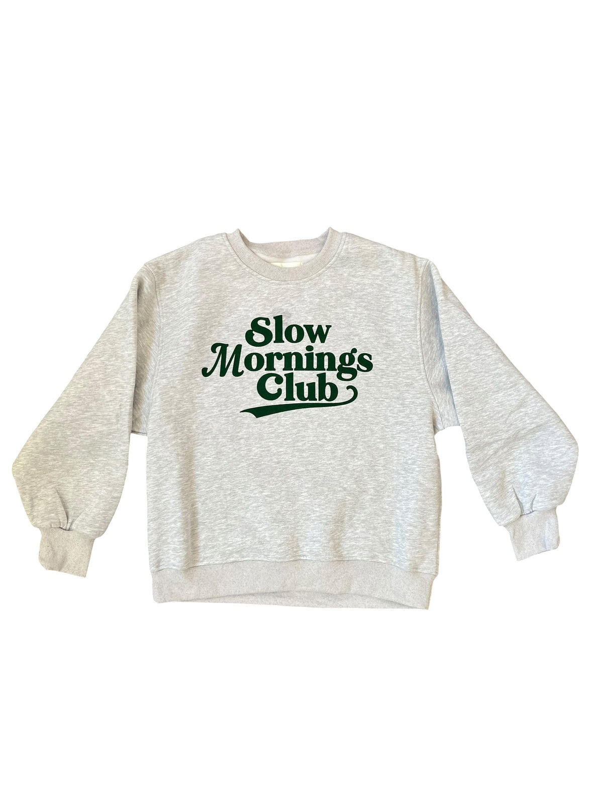 A light heather gray crewneck sweatshirt with 'Slow Mornings Club' printed in dark green across the chest, displayed flat against a white background.