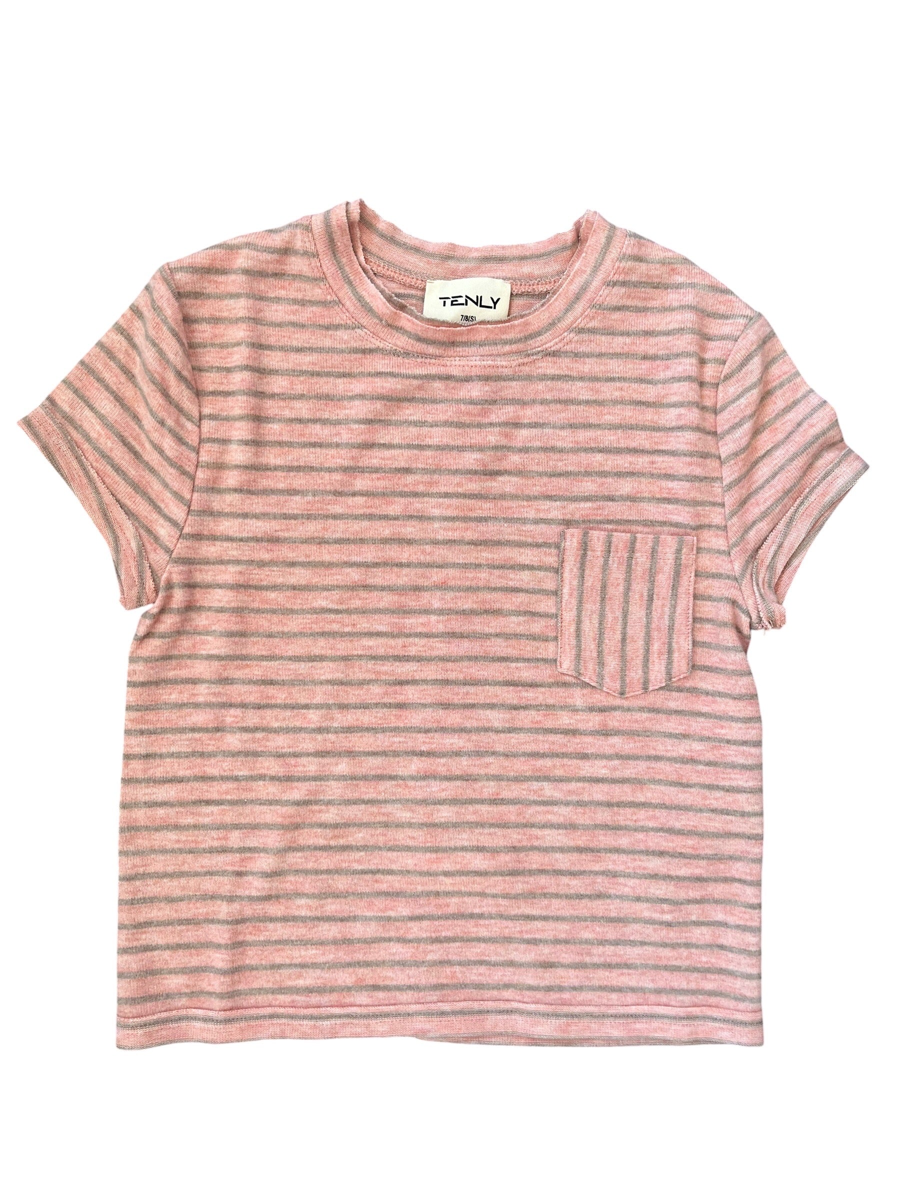 A short-sleeve crewneck t-shirt with horizontal pink and beige stripes, featuring a left chest pocket with vertical stripes, shown flat on a white background.